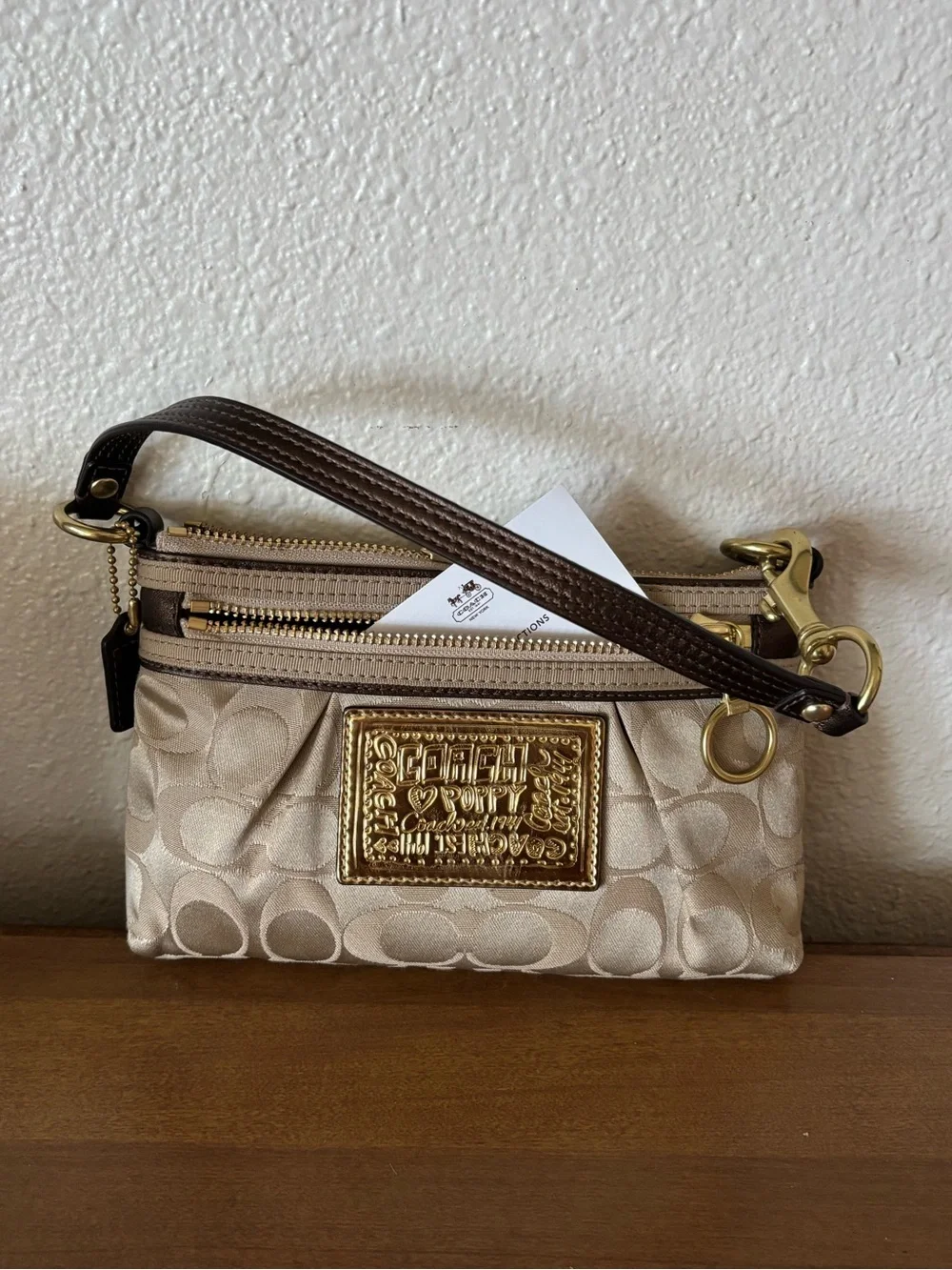 Coach Beige Signature Wristlet Pouch with Gold Logo Plaque